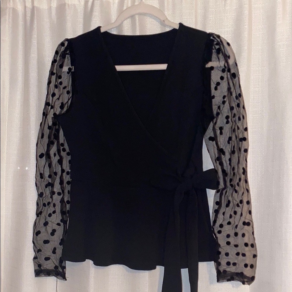 Elegant Black Wrap Top with Sheer Polka Dot Sleeves
